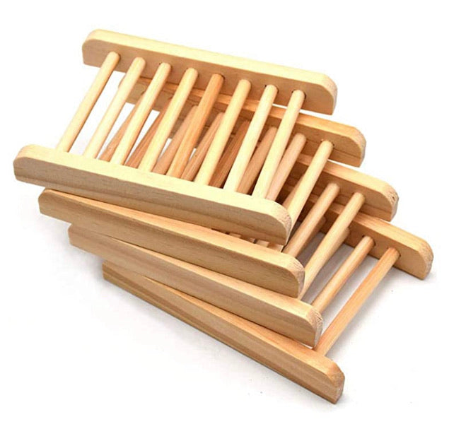 Natural light wood slatted soap dish rack designed to keep handmade soap bars elevated and dry between uses.