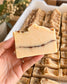 Home for Fall soap bar held in hand showing cinnamon swirl