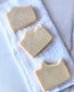 Three Eden Body Care Classic Unscented goat milk soap bars arranged on a folded white towel in a clean flat-lay display