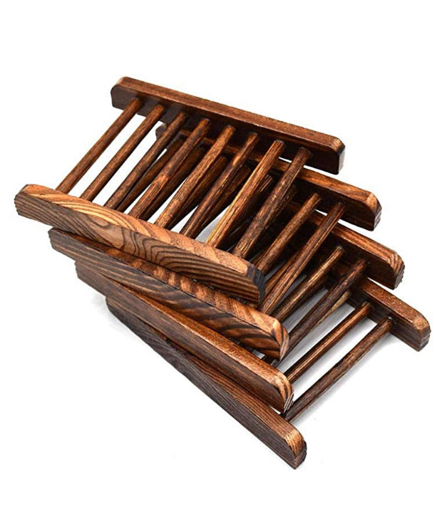 Dark wooden slatted soap dish rack designed to keep handmade soap bars elevated and dry between uses.